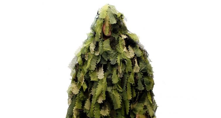 blend into the forest with a ghillie suit
